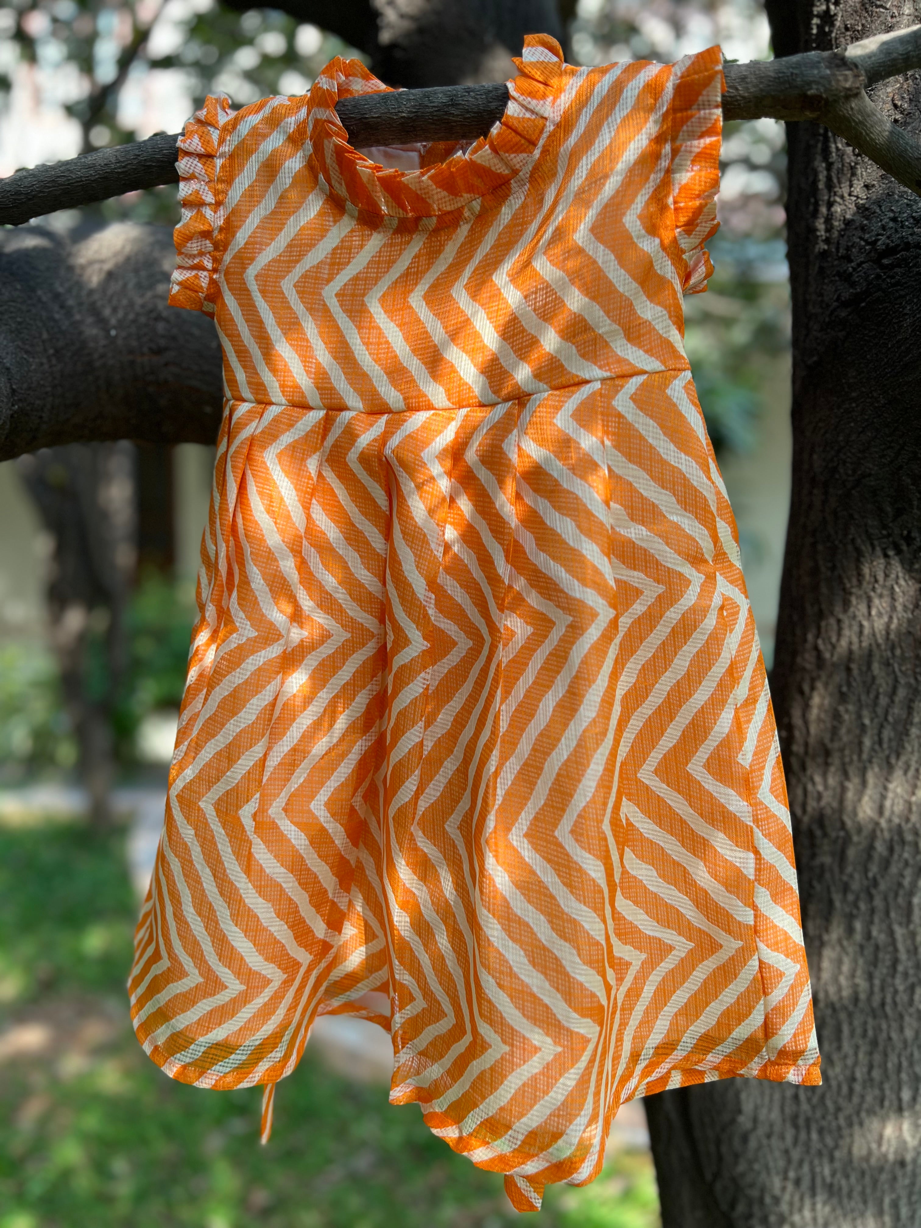 Orange frock frill on neck and sleeve