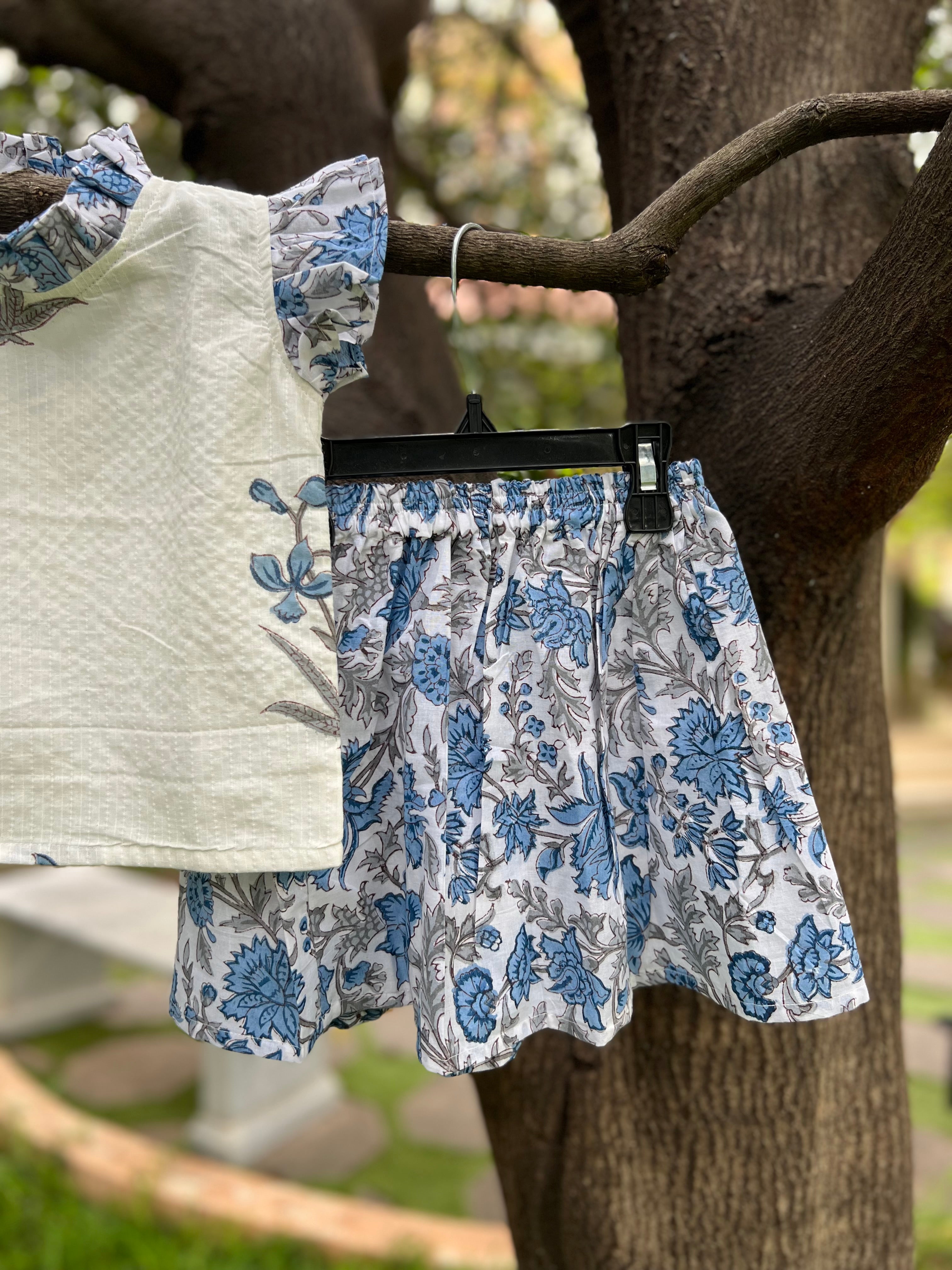 White & Blue Floral cotton, frill on sleeve & neck.