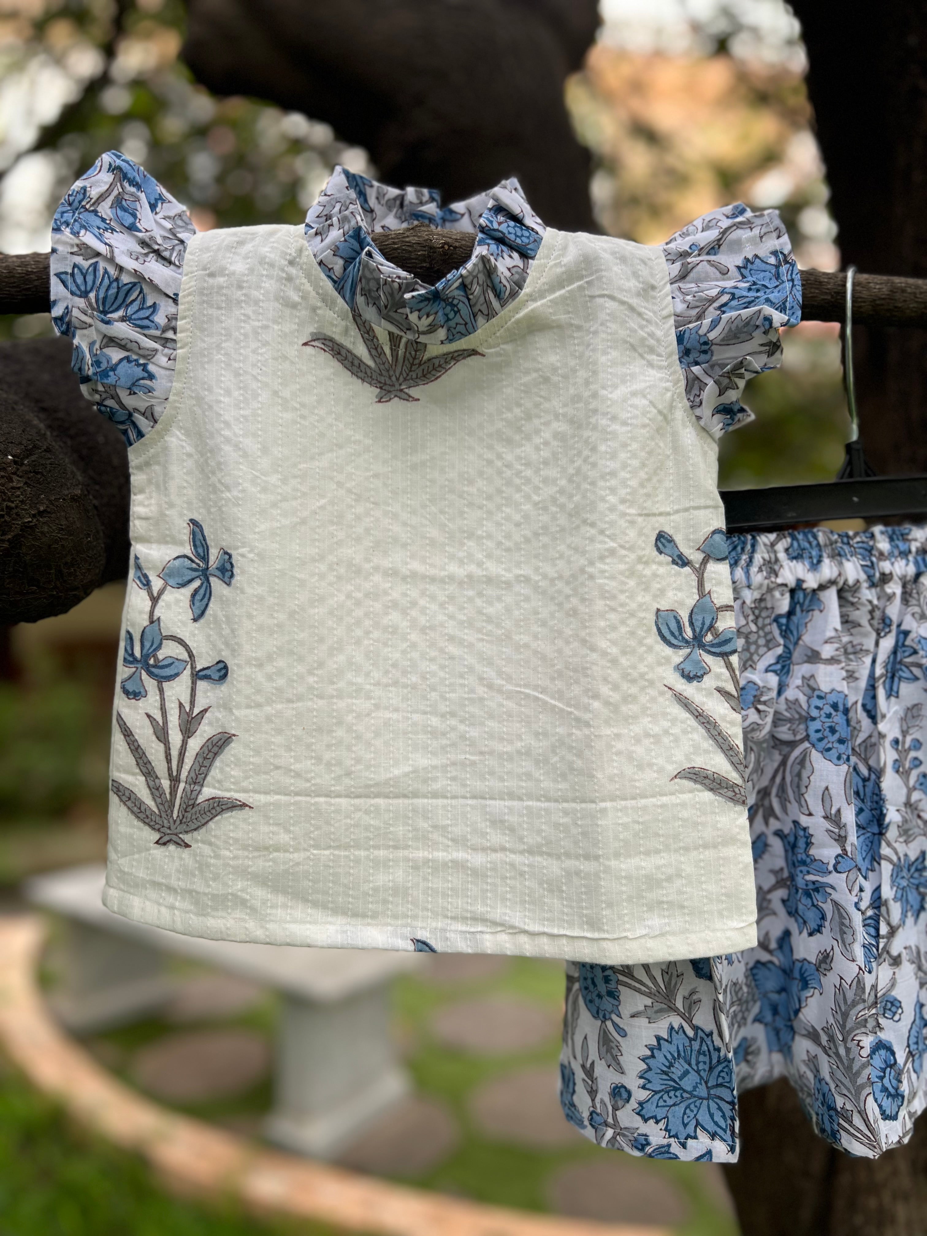 White & Blue Floral cotton, frill on sleeve & neck.