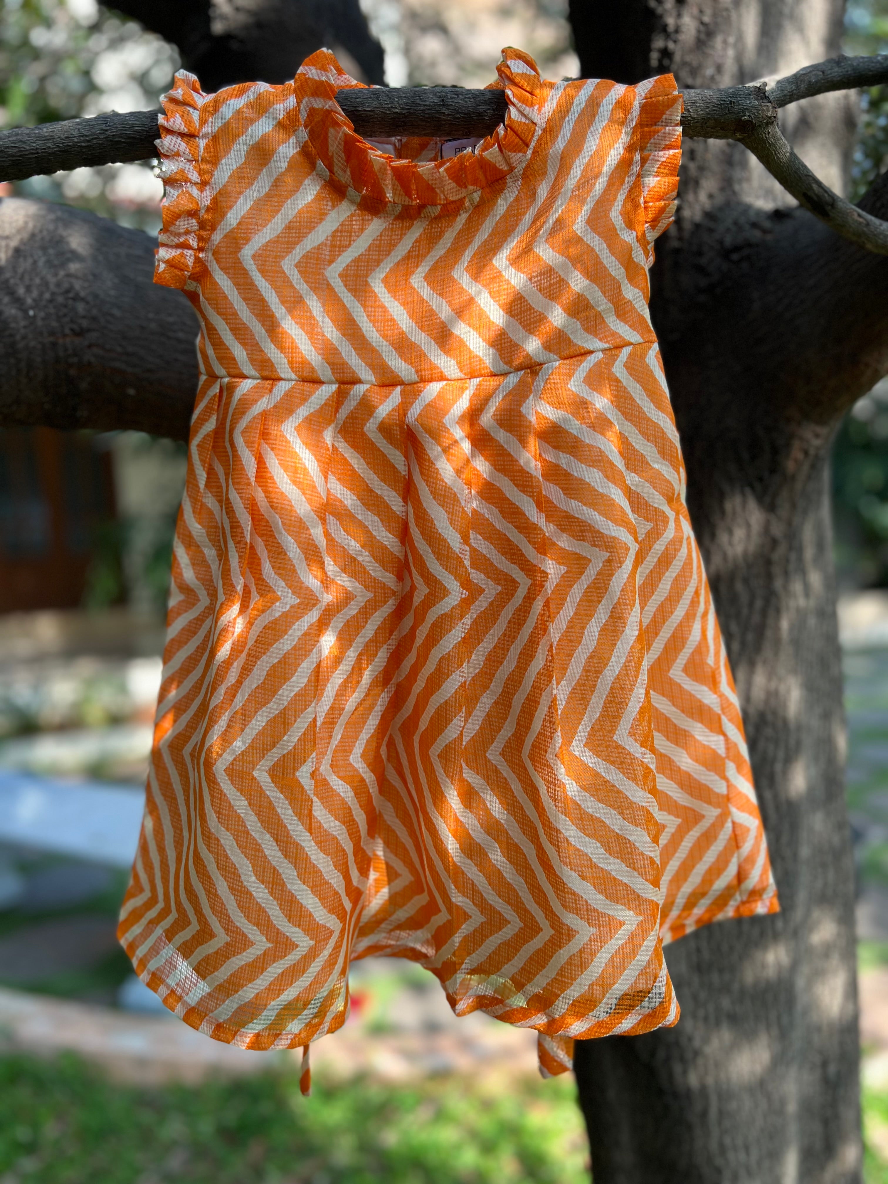 Orange frock frill on neck and sleeve