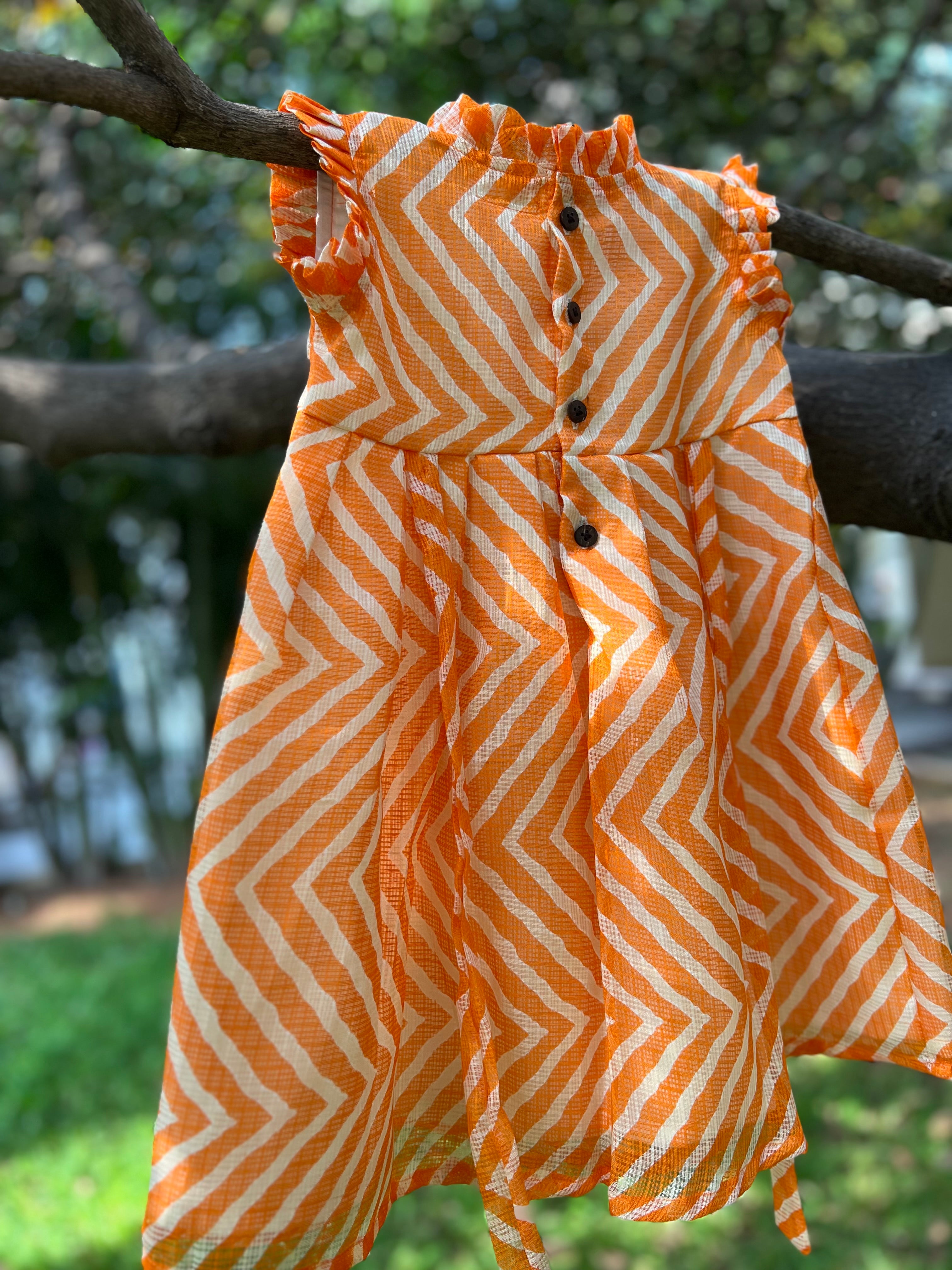 Orange frock frill on neck and sleeve