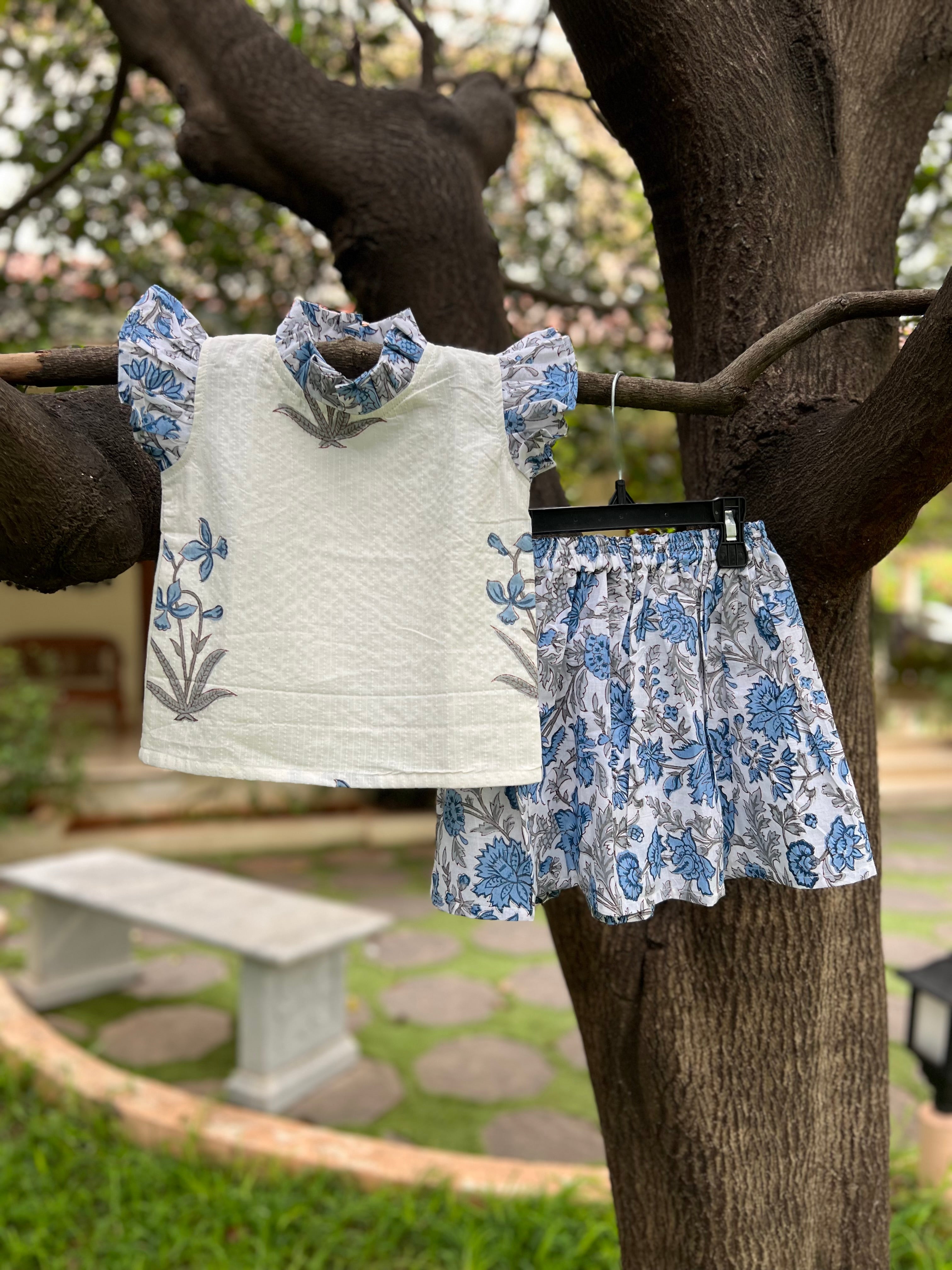 White & Blue Floral cotton, frill on sleeve & neck.