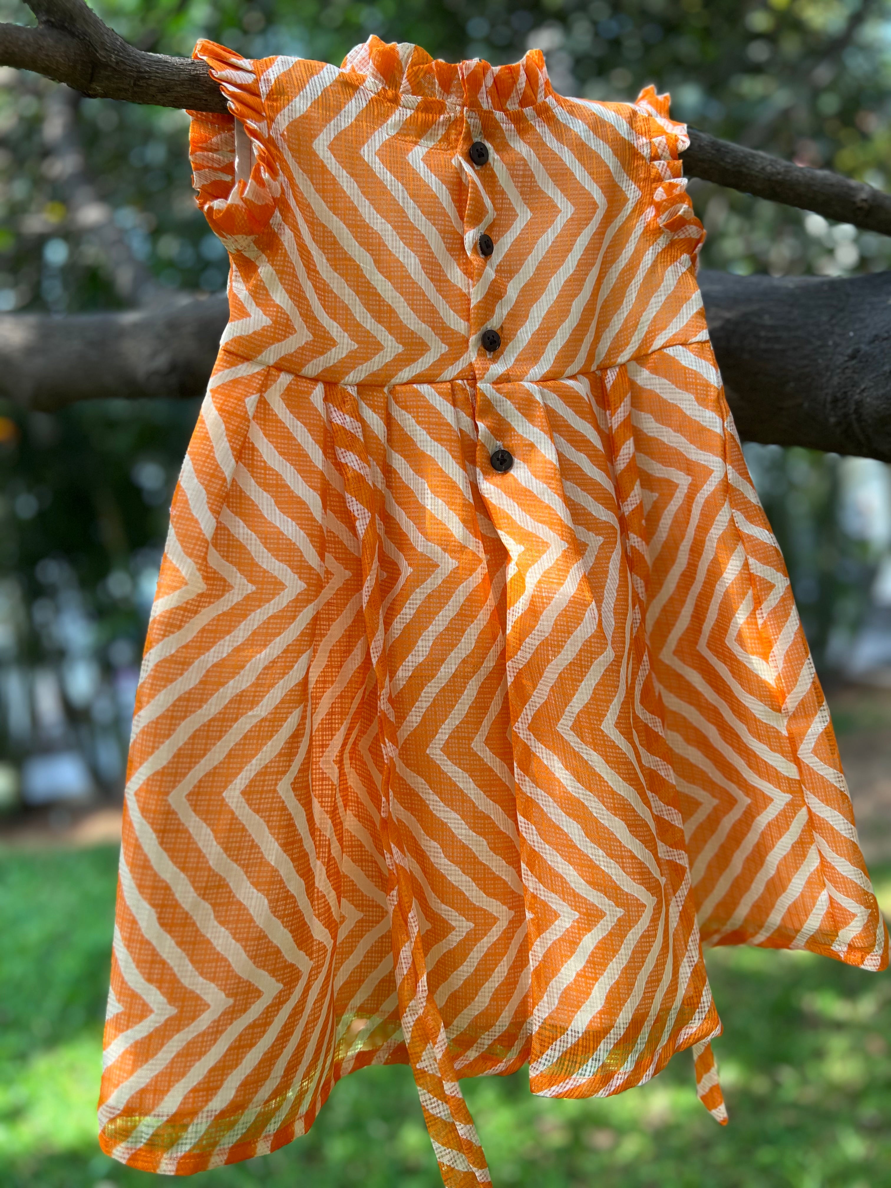 Orange frock frill on neck and sleeve