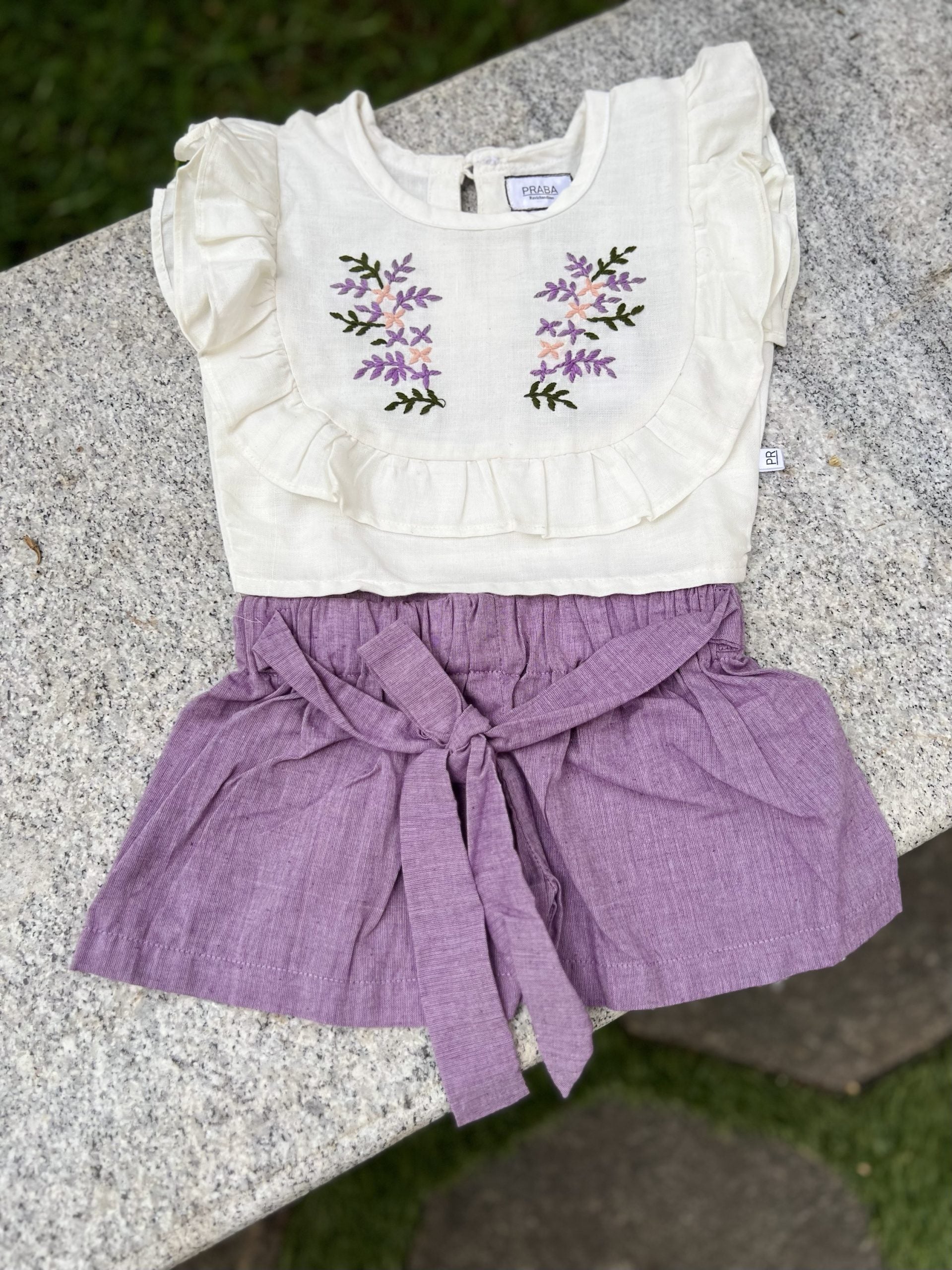 White floral top and bow shorts