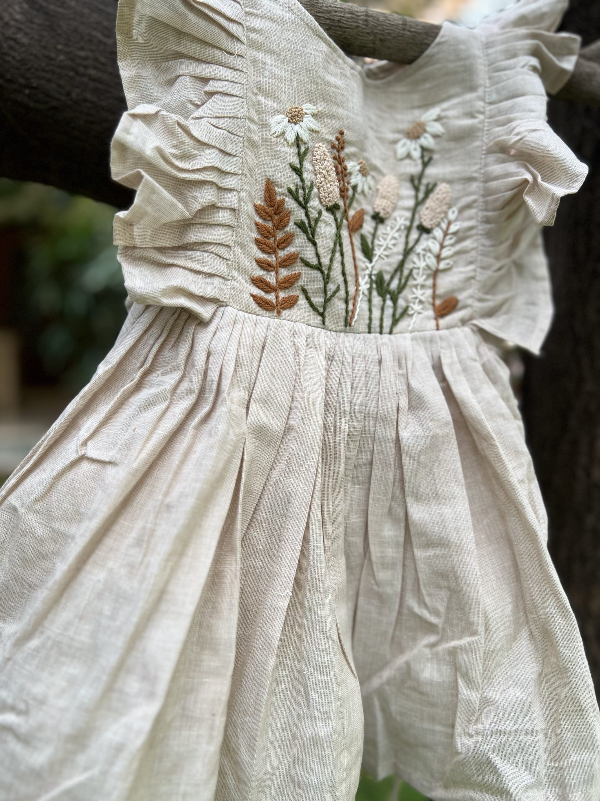 Beige dress with hand embroidered flowers