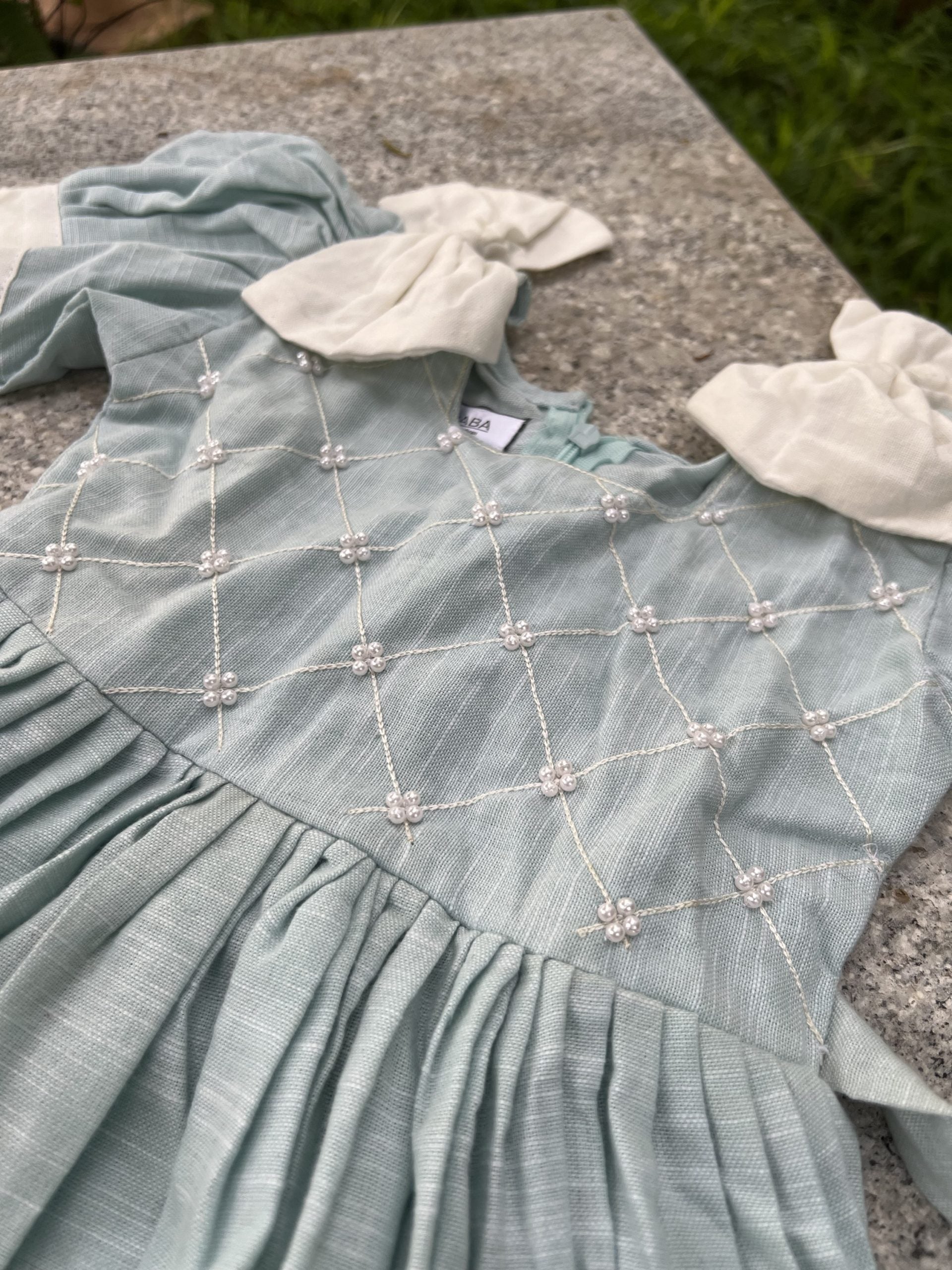 Blue and White Dress with White Ruffles and Bows