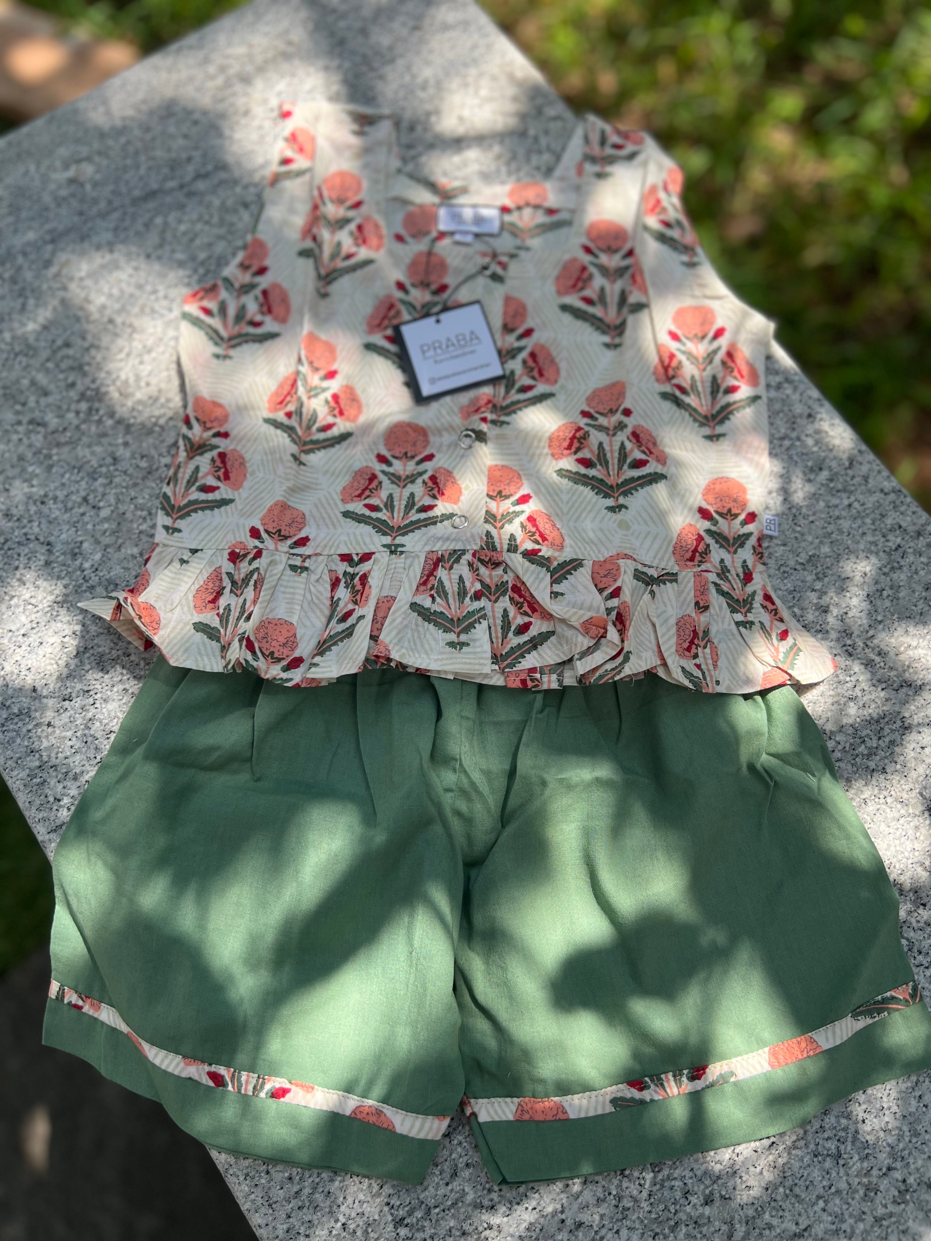 Floral printed tops & green shorts