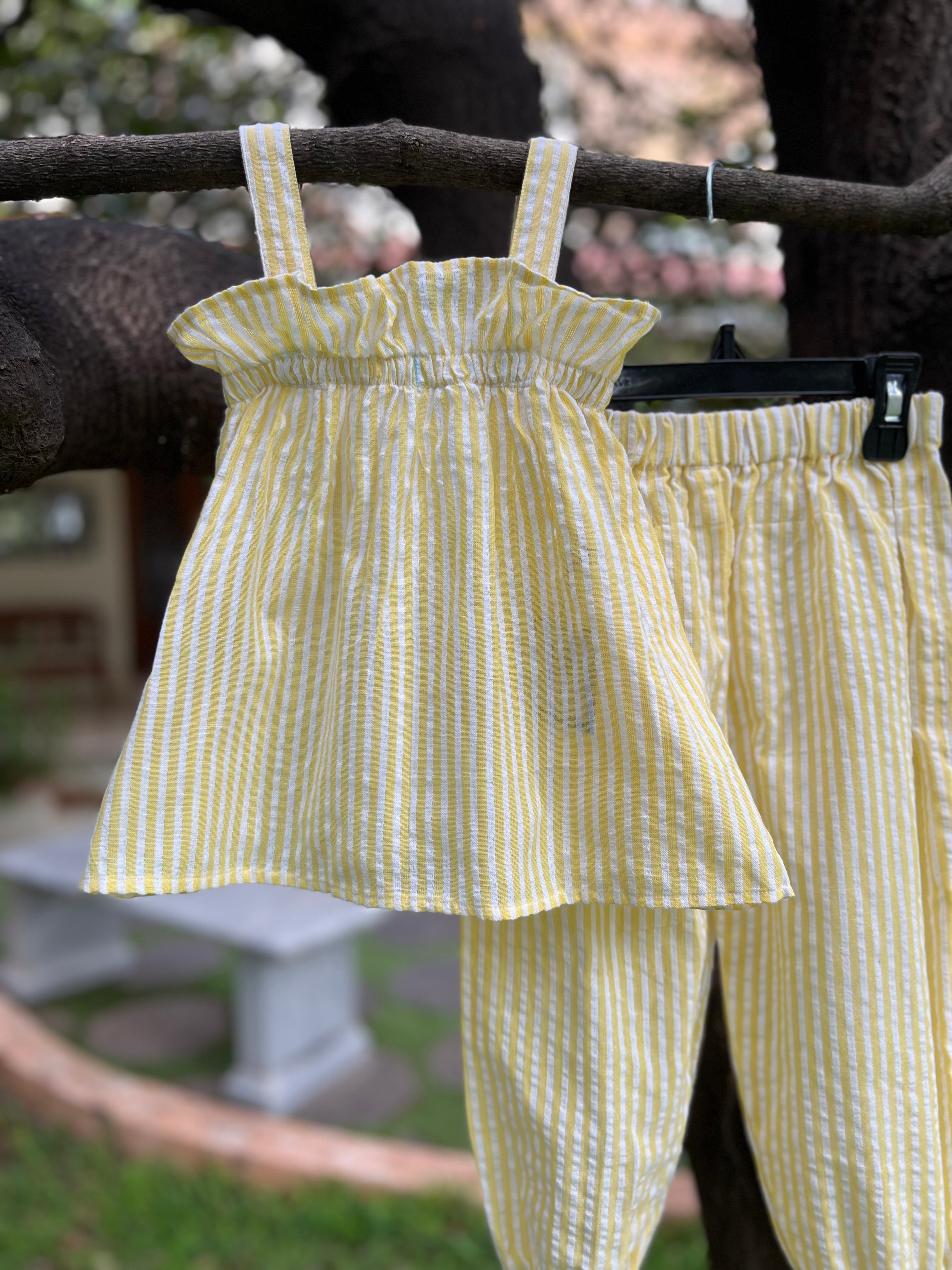 Yellow strip with frills on Top and pant bottom