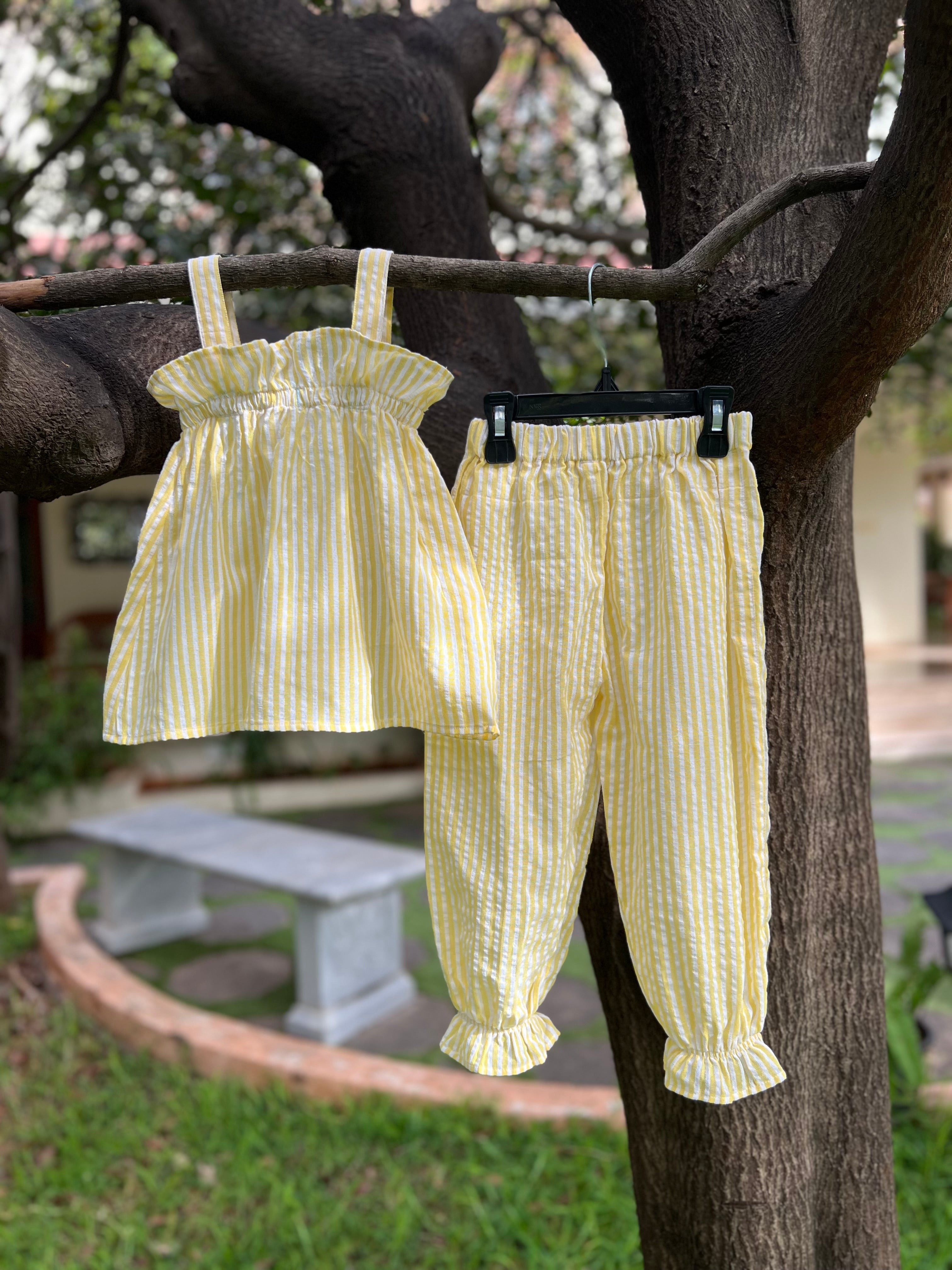 Yellow strip with frills on Top and pant bottom