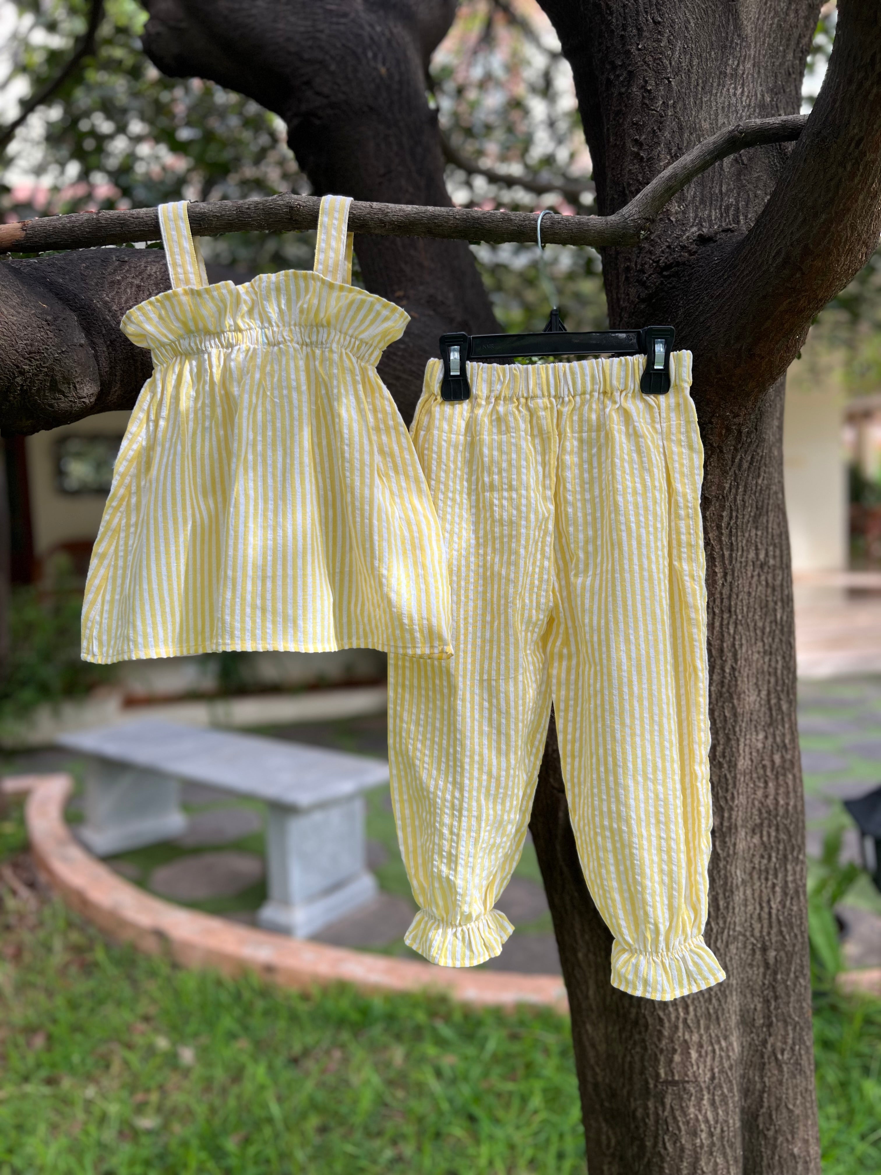 Yellow strip with frills on Top and pant bottom