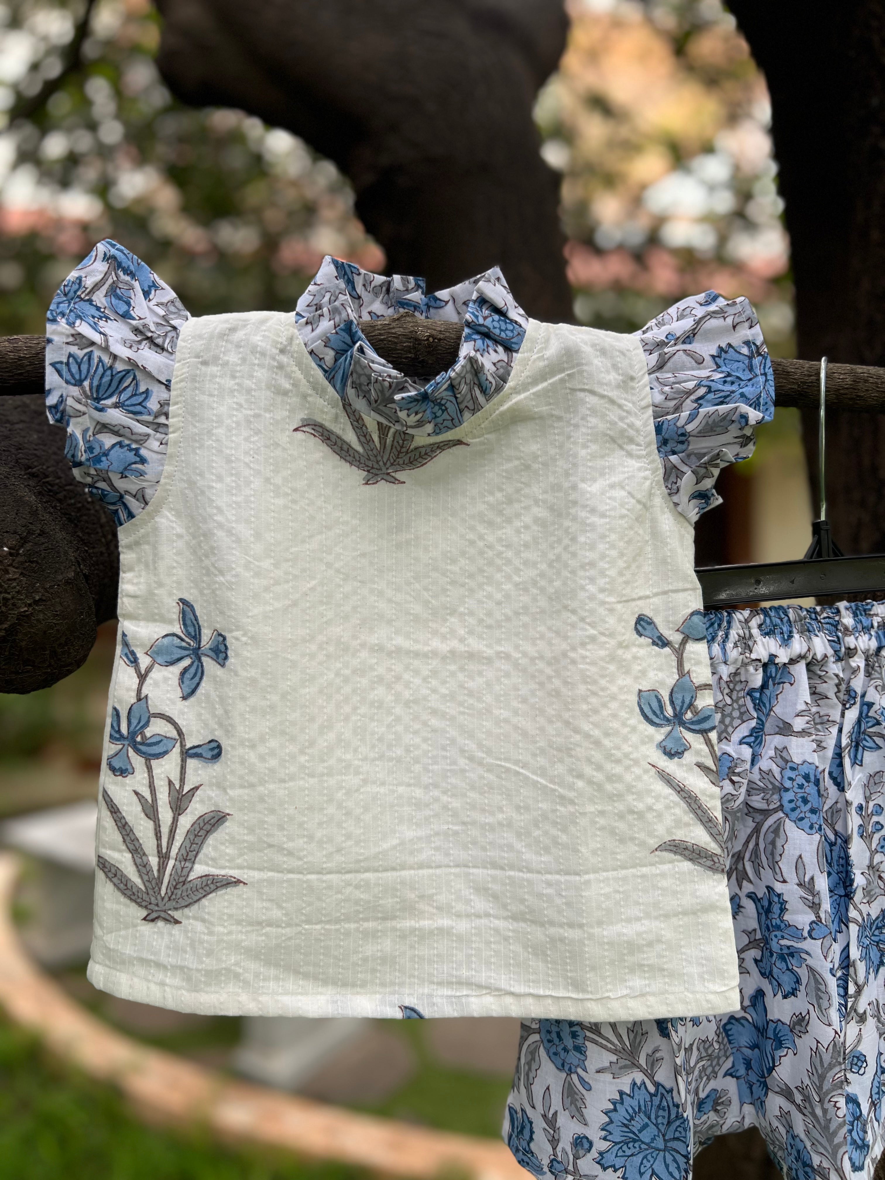 White & Blue Floral cotton, frill on sleeve & neck.