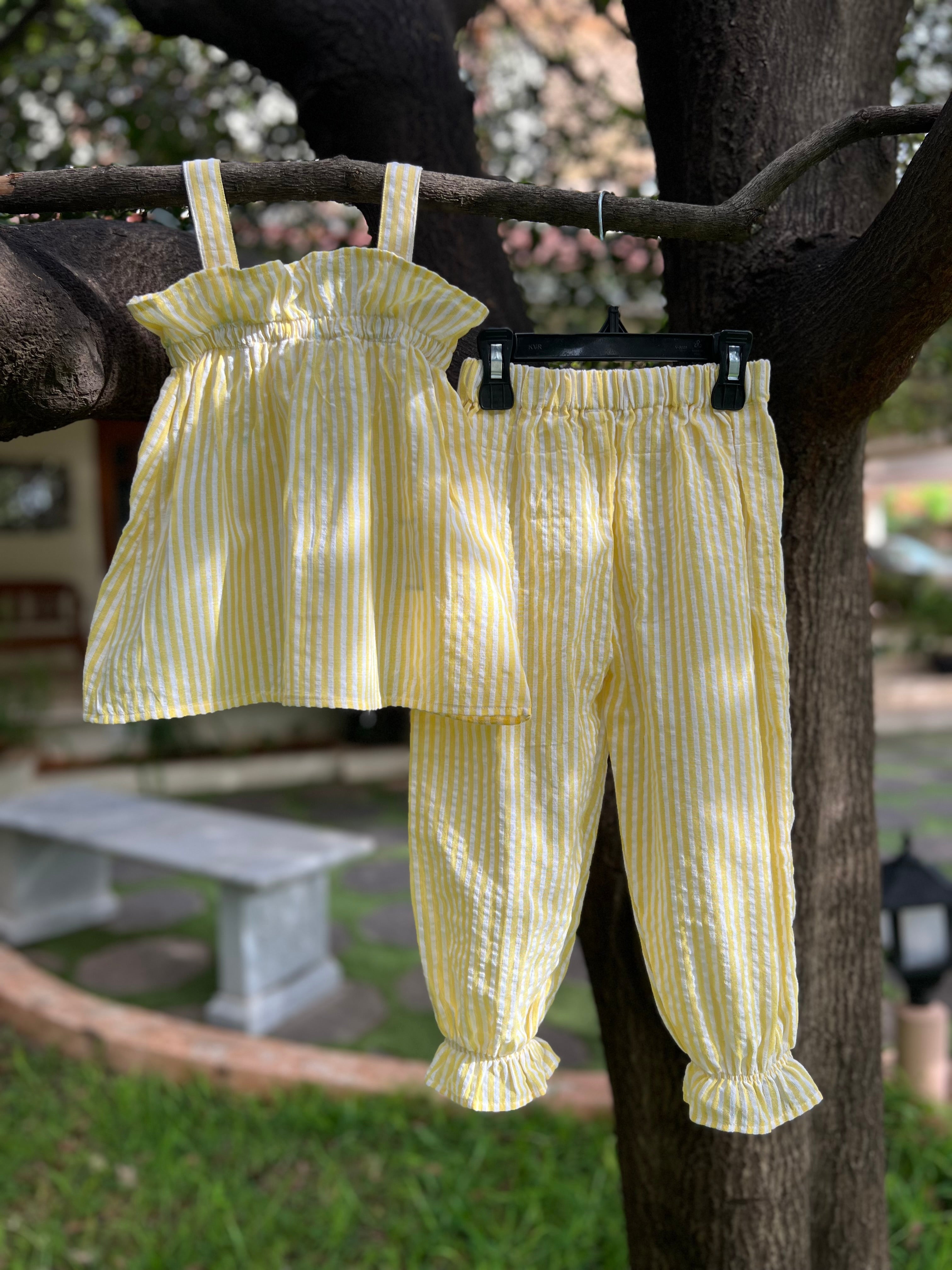 Yellow strip with frills on Top and pant bottom