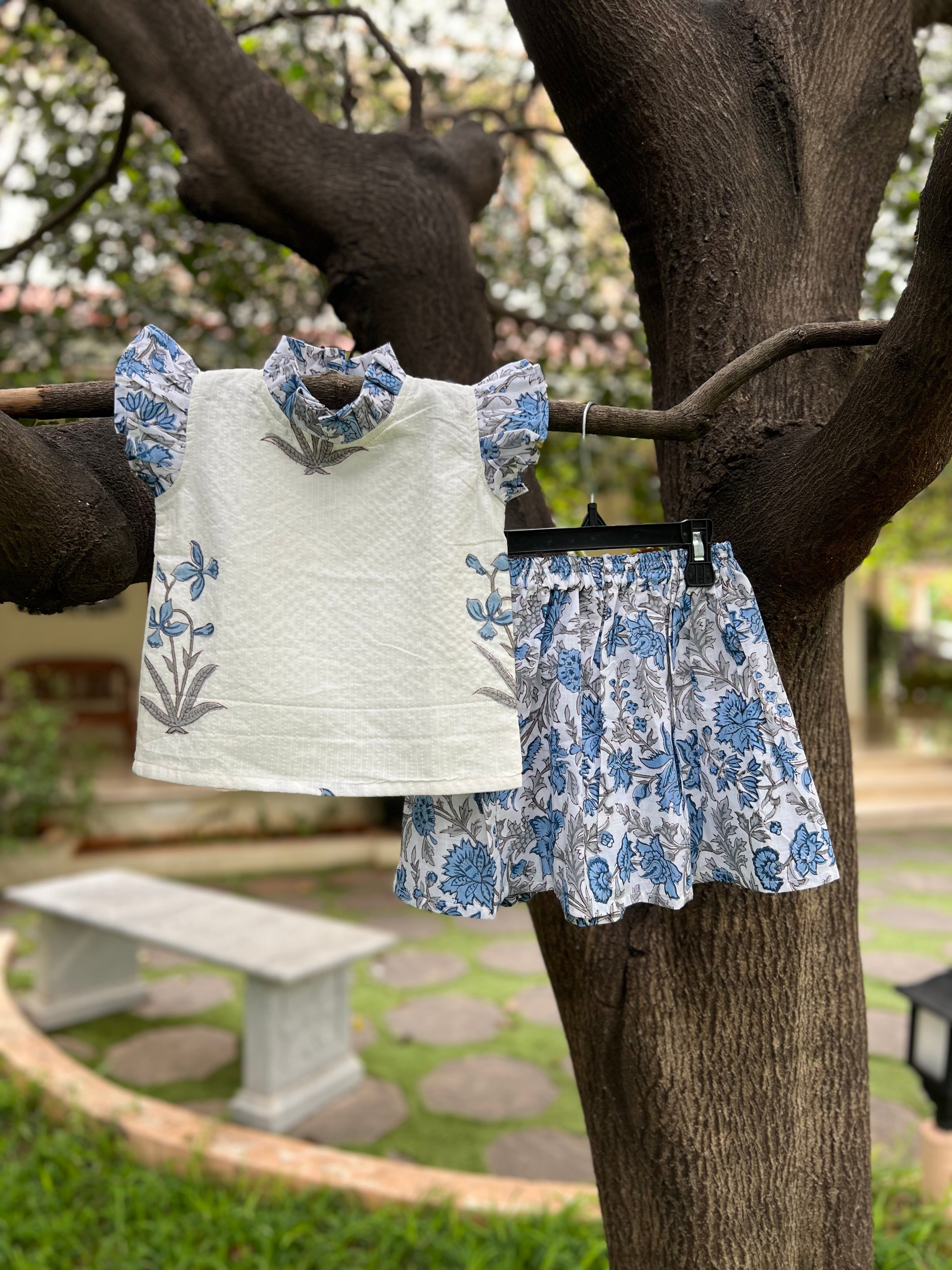 White & Blue Floral cotton, frill on sleeve & neck.