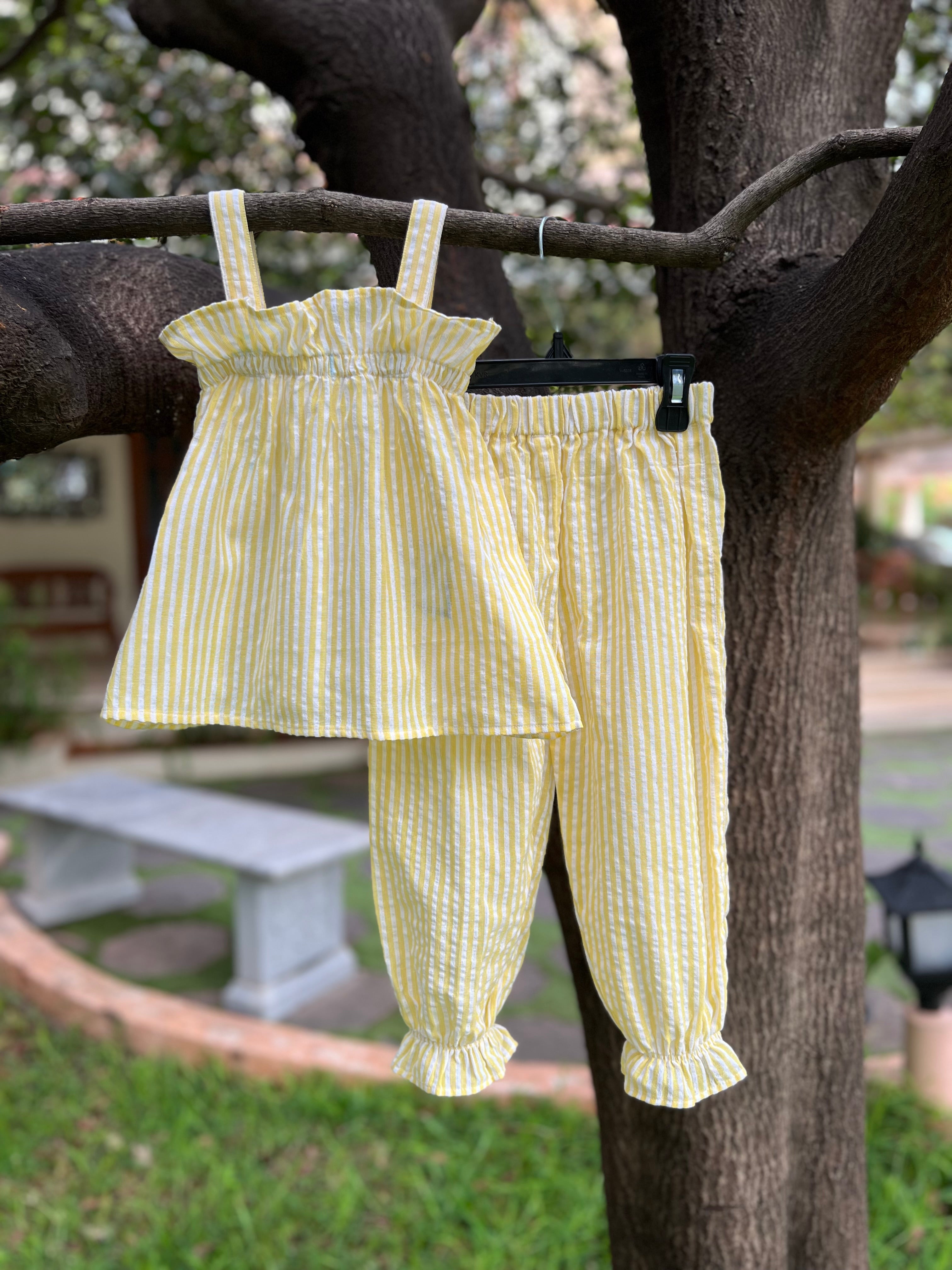 Yellow strip with frills on Top and pant bottom