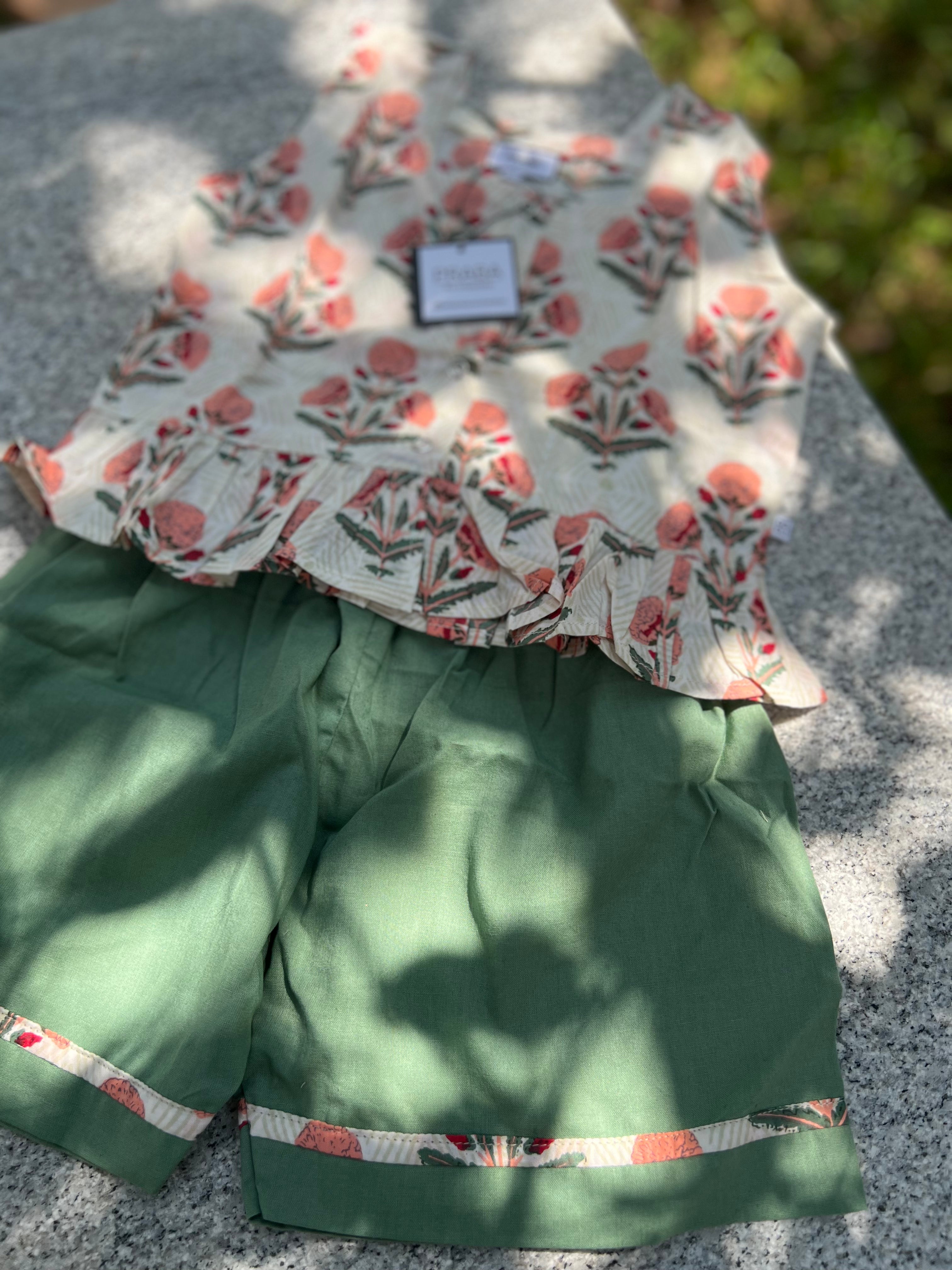 Floral printed tops & green shorts