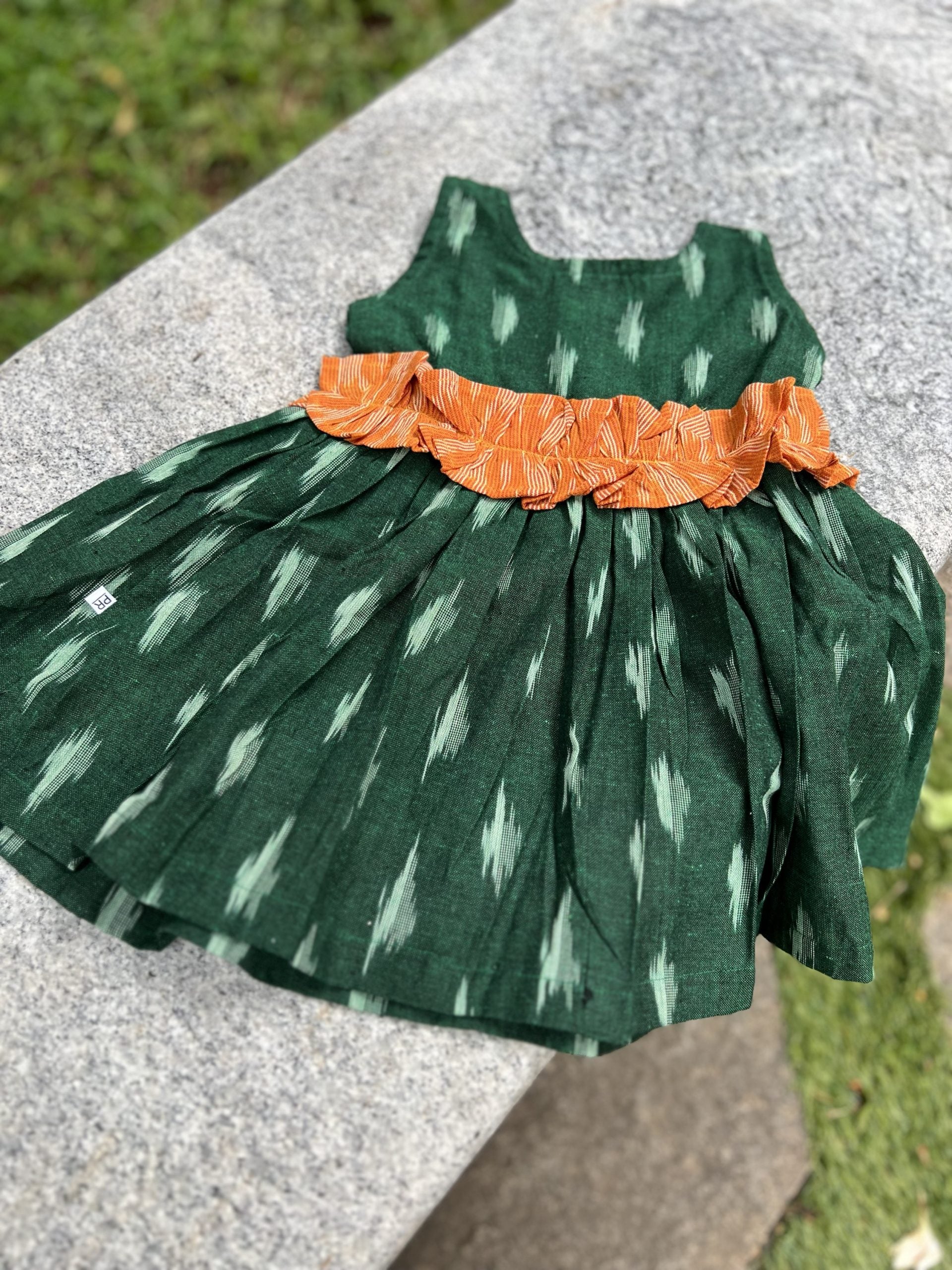 Whimsical Green Ikkat Dress with Orange Ruffles
